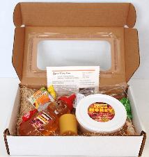 Gift Box includes 12 oz. honey Bear, 1 lb. Spun Honey,Pure Beeswax Votive Candle,Honey Candy,6 Pack Honey Straws and Brochure